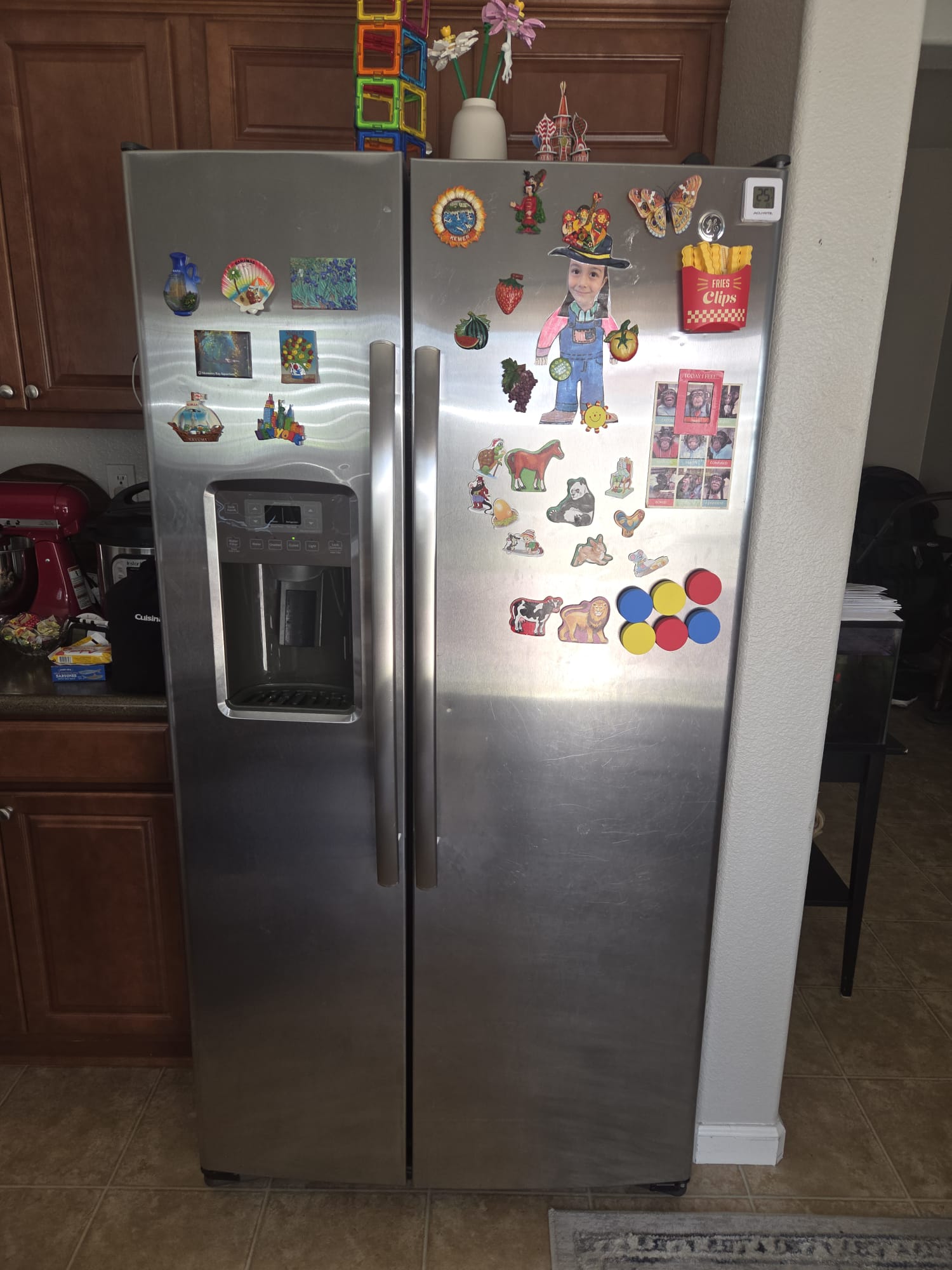 GE side-by-side refrigerator fully reassembled and cooling normally after the defrost repair