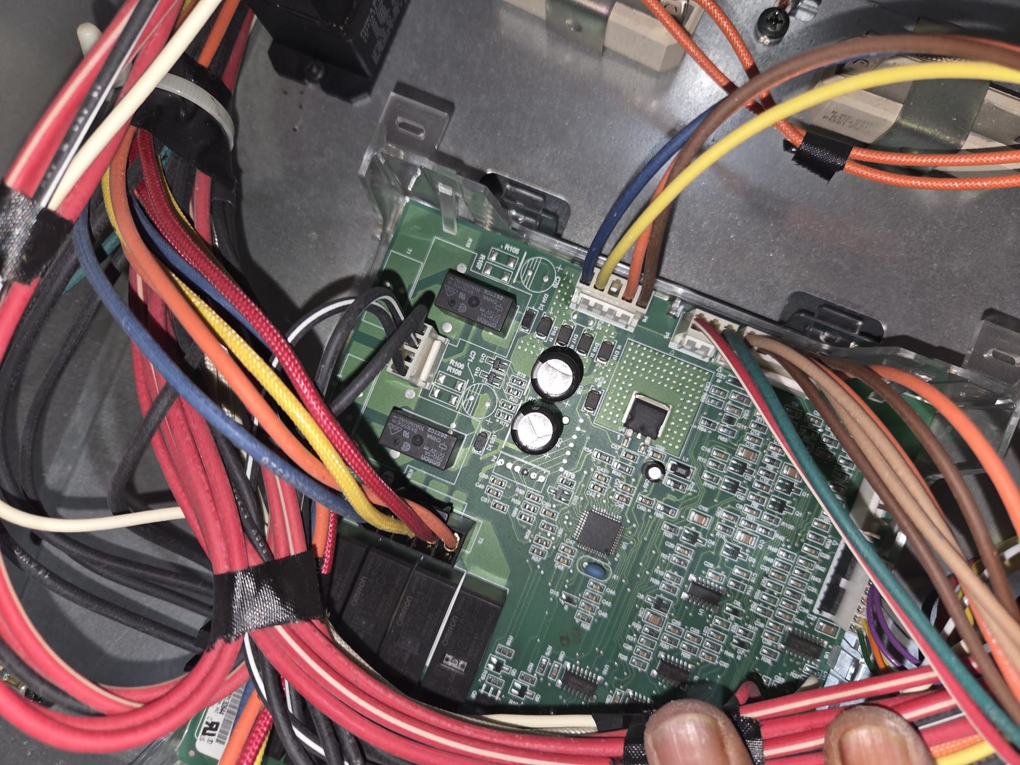 New main control board installed in the Wolf wall oven with the wiring harness reconnected